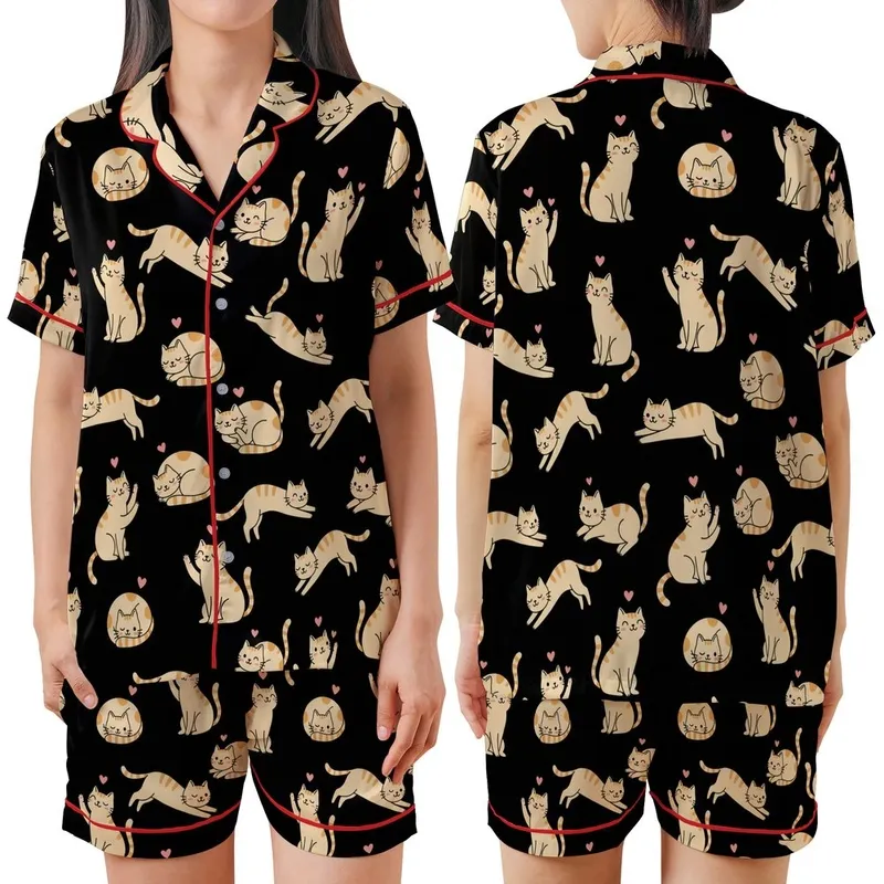 Cat Lovers' Whimsical Black Seamless Pattern with White & Orange-Tan Flat Cartoon Cats & Pink Accents Satin Short-Sleeve Pajamas Set - 1