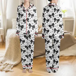 Women's Whimsical Black Bows White Stars Moons 'Good Night' Script Repeating Pattern Satin Pajamas Set