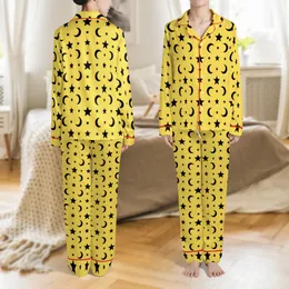 Celestial Enthusiast: Vibrant Lemon Yellow Black Star Moon Seamless Graphic Fashion Accent Satin Short-Sleeve Pajamas Set
