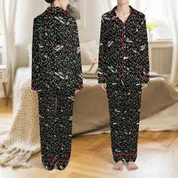 Festive Admirers' Seamless Intricate Multicolor Christmas String Light & Bold White Text Black Pattern Satin Pajamas Set