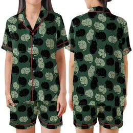 Cat Lovers' Playful Plump Minimalist Black Muted Green Cartoon Cats Forest Green Repeating Pattern Satin Short-Sleeve Pajamas Set