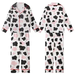 Modern Fashion Enthusiasts' Playful White Black Pastel Pink Organic Cow Blotches Kid Satin Pajamas Set