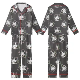 Cat Lovers' Whimsical Black White Grey Tabby Kitten Pattern with Sky Blue Eyes Holding Green Leaf Branch on Charcoal Kid Satin Pajamas Set