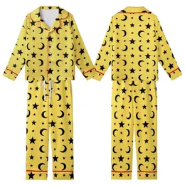 Celestial Enthusiast: Vibrant Lemon Yellow Black Star Moon Seamless Graphic Fashion Accent Kid Satin Pajamas Set