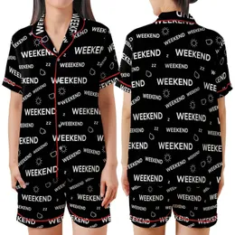 Weekend Lover: Scattered Typographic 'WEEKEND' Pattern with Leisure Icons - Black & White Motif Satin Short-Sleeve Pajamas Set