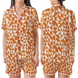 Dynamic Fragmented Geometric Mosaic: Orange White Interlocking Shapes Satin Short-Sleeve Pajamas Set