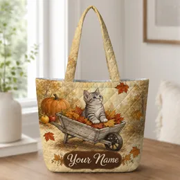 Autumn Tabby Kitten in Leaf-Filled Wheelbarrow for Fall Market Trips and Cat Lovers Quilted Tote Bag