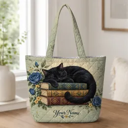 Black Cat Sleeping on Books for Cozy Reading Days and Cat Lovers Quilted Tote Bag