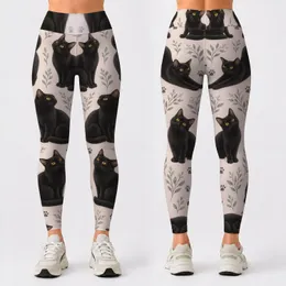 Black Cat and Golden Eyes for Cozy Weekend Style and Everyday Cat Lover Outings Leggings