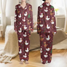 Holiday Lovers' Whimsical Cartoon Christmas Ducks Festive Maroon Pattern with Santa Hats, Reindeer Antlers, and String Lights Satin Pajamas Set