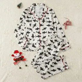 Ocean Enthusiasts' Playful Black Cartoon Shark Cream All-Over Print Red Gums Green Eyes Satin Pajamas Set
