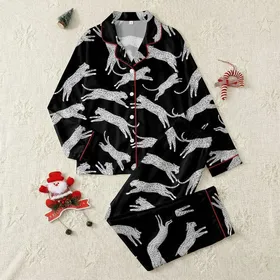 Women's Dynamic White Speckled Leaping Leopard Graphic on Stark Black Satin Pajamas Set