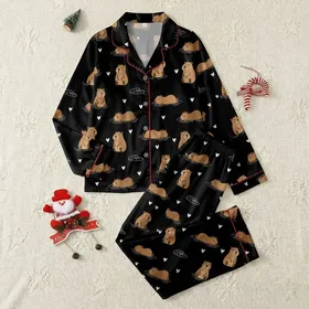 Ladies' Warm Brown Cartoon Capybara Lounging Lily Pad & White Heart Pattern Black Background Satin Pajamas Set