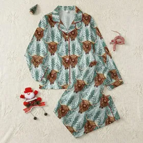 Rustic Holiday Enthusiasts' Painterly Highland Cow Snowy Forest Christmas Lights Repeat Pattern Satin Pajamas Set