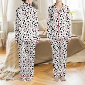 Cow Lovers' Whimsical Flat 2D Cartoon Cow Faces Soft Pink Snouts Orange Horns Organic Black Spots Pure White Pattern Satin Pajamas Set
