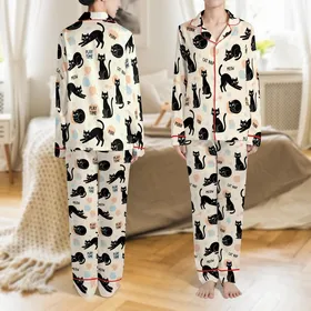 Cat Lovers' Whimsical Black Cat Seamless Pattern Playful Feline Warm Cream Peach-Orange Sky-Blue Accents Satin Pajamas Set