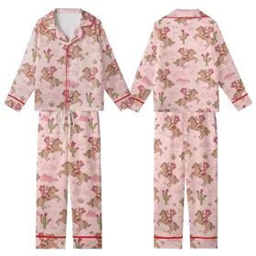 Western Enthusiasts' Whimsical Cowgirl Desert All-Over Print with Pink Hats, Coral Shirts, and Fuchsia Cacti Kid Satin Pajamas Set