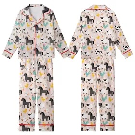 Whimsical Farm Life Admirers Light Pink Flat Art Farm Animal Pattern: Stylized Horses, Cows, Sheep, Rabbits, Roosters, Ducks Kid Satin Pajamas Set
