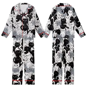 Feline Enthusiasts' Interlocking Black White Gray Cartoon Cat Faces Paws Tails Pattern Pink Accents Kid Satin Pajamas Set