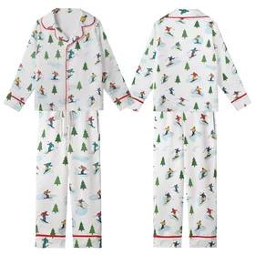 Winter Sports Enthusiast Playful Cartoon Ski & Snowboard Action Scene with Vibrant Yellow Red Blue Figures & Green Trees Kid Satin Pajamas Set