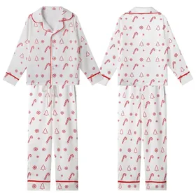 Holiday Enthusiasts' Bright Red White Flat Graphic Christmas Candy Cane Snowflake Tree Seamless Pattern Kid Satin Pajamas Set