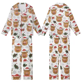 Festive Highland Cow Christmas Design: Cartoon Santa Hat, Plaid Bow, Pine, Snowflake Accents Kid Satin Pajamas Set