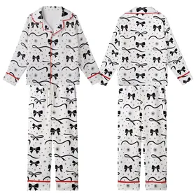 Elegant Black Bows & Flowing Ribbons Scattered Blouse with Star Accents Kid Satin Pajamas Set