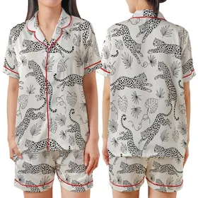 Leopard Lover: Dynamic Leaping Leopard Outline Print with Jungle Vines Off-White Statement Layer Satin Short-Sleeve Pajamas Set