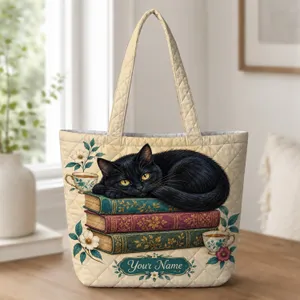 Black Cat Curled on Library Books for Cozy Reading Days and Book Lover Gifts Quilted Tote Bag