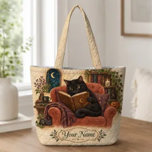 Black Cat Reading by Pumpkinlight for Cozy Halloween Book Lovers and Cat Fans at Home Quilted Tote Bag