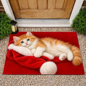 Ginger Kitten Resting on Santa Hat for Cozy Christmas Cheer for Cat Lovers Everywhere Doormat