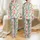 Festive Humor Enthusiasts' Whimsical Red Green White Six Seven Number Pattern with Polka Dots, Santa Hats, Holiday Lights, & Gold Stars Satin Pajamas Set - 1