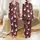 Holiday Lovers' Whimsical Cartoon Christmas Ducks Festive Maroon Pattern with Santa Hats, Reindeer Antlers, and String Lights Satin Pajamas Set - 1