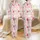Women's Blush Pink Whimsical Christmas Santa Reindeer Pastel Teal Tree Gift Bow Pattern Satin Pajamas Set - 1