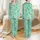 Women's Bright Mint Green All-Over Western Desert Pattern with Teal Cacti, Peach Cowboy Boots, & White Sheriff Stars Satin Pajamas Set - 1