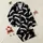 Women's Dynamic White Speckled Leaping Leopard Graphic on Stark Black Satin Pajamas Set - 1