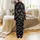 Holiday Revelers' Playful 'Most Likely To' Christmas Phrases, Minimalist Santa Hats, Snowflakes, Stars on Black Satin Pajamas Set - 3