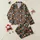 Retro Enthusiasts Groovy 70s Muted Teal Orange Pink Olive Beige Letter Floral Lightning Bolt Geometric Pattern on Black Satin Pajamas Set - 1