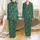 Otter Lovers: Playful Santa Otter & Snowflake Pattern on Forest Green - Festive Wearable Art Satin Pajamas Set - 1