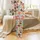 Holiday Enthusiasts' Whimsical Flat Graphic Christmas Donut Pattern: Reindeer, Red, Blue, Yellow Frosted with Sprinkles & Holly Satin Pajamas Set - 2