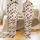 Holiday Enthusiasts' Hand-Drawn Christmas Chickens Festive Pattern with Santa Hats & Lights on Pale Beige Satin Pajamas Set - 1