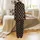Quirky Animal Lovers' Warm Brown Grumpy Cartoon Highland Cow Calves All-Over Pattern with 'Moo.' Text on Solid Black Background Satin Pajamas Set - 3