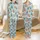 Holiday Highland Cow Red Santa Hat Multi-Color Lights Blue Snow Snowflake Christmas Tree Design Satin Pajamas Set - 1