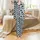 Dynamic Cow Print Design: Bold Black Organic Spots with Layered Vibrant Blue Shapes on White Satin Pajamas Set - 2