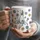 Personalized Mom Holding Hands Black Mug with Kids Names, Custom Floral Mother's Day Gift, 3D Effect Floral Coffee Cup for Mommy - 2