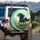 Shaggy Black Pony Wild Mane Flowing Tail Green Grass Orange Wildflowers - Wildlife Lover Gift Spare Tire Cover - 3