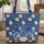 Majestic Blue Winged Dragon Blooming Roses Green Foliage Heart Everyday Carry Gift Quilted Tote Bag - 1