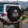 Deep Black Background Light Gray Fur Baby Sloth Yawning in Human Hands - Wildlife Lover Gift Spare Tire Cover - 3