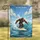 Muscular Bigfoot Surfing Tropical Ocean Wave Under Blue Sky - Coastal Home Decor Gift Garden Flag - 1