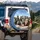 Six Doberman Dogs Driving Car Interior, Expansive Blue Sky Green Foliage - Dog Lover Gift Spare Tire Cover - 3
